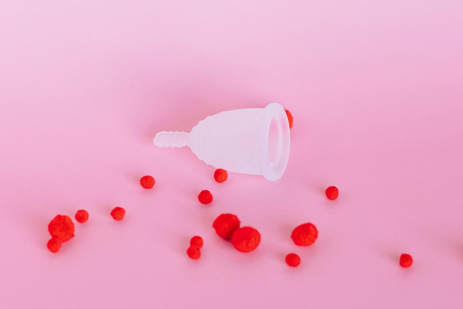 White Plastic Pitcher With Red and Blue Beads