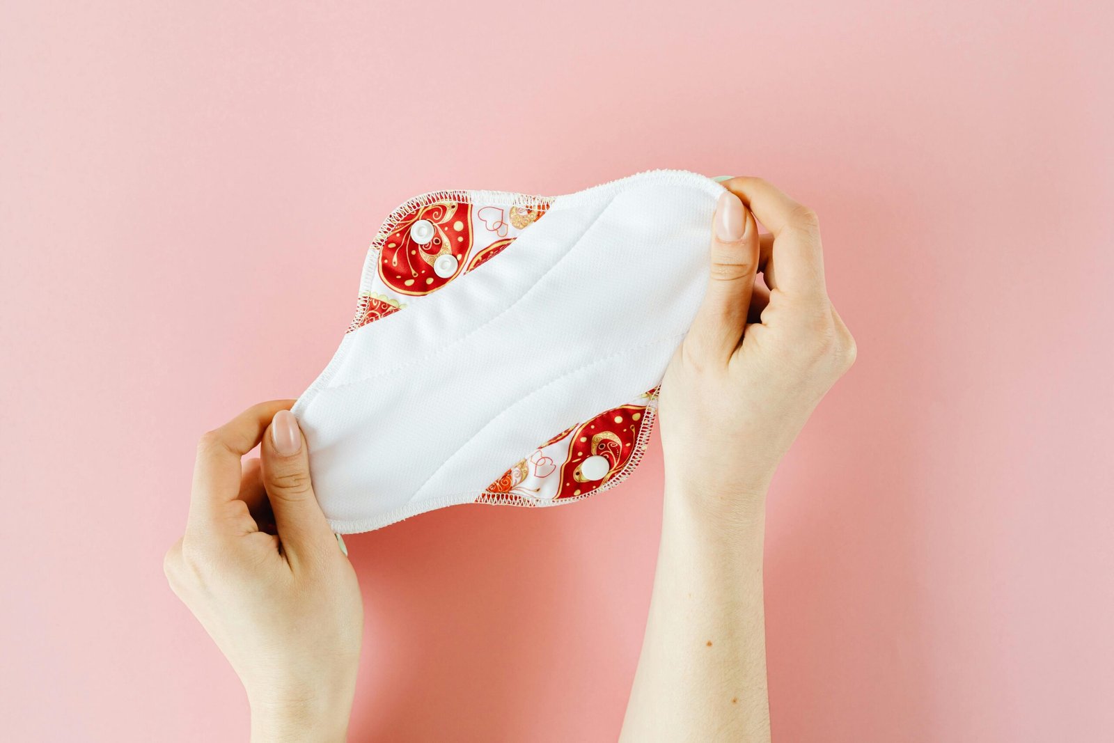 A Person holding Menstrual Pad